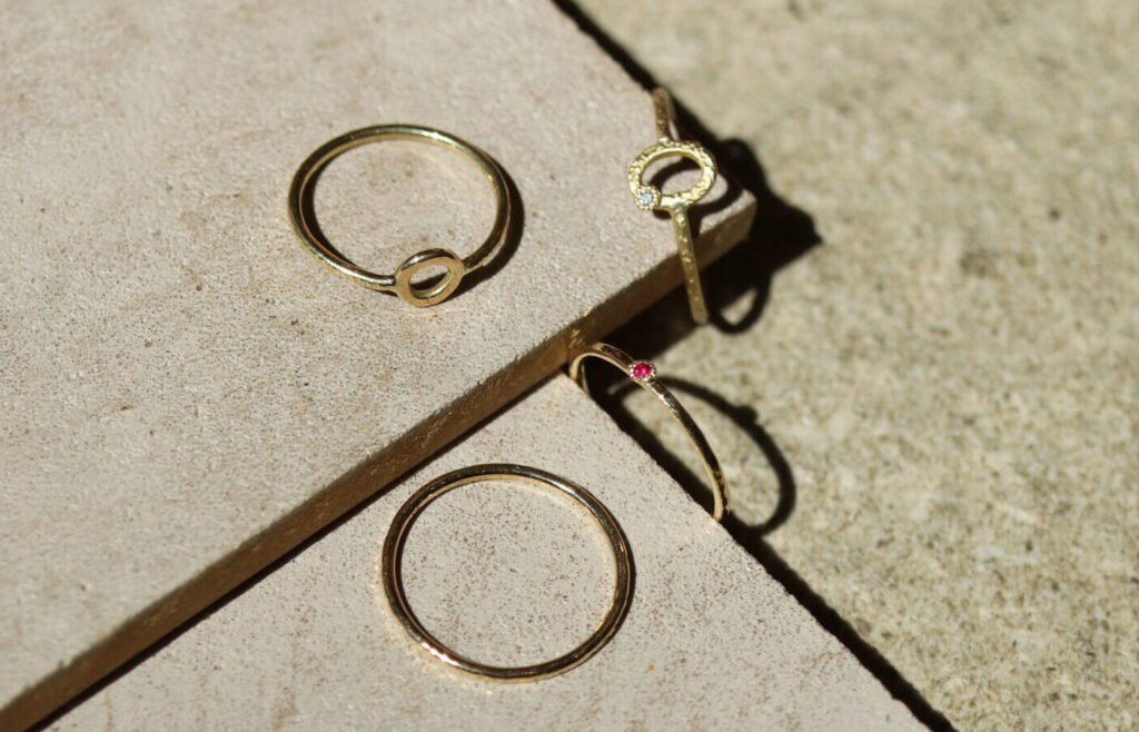 Slim 18K gold Kasane rings with gold loop and gemstone details