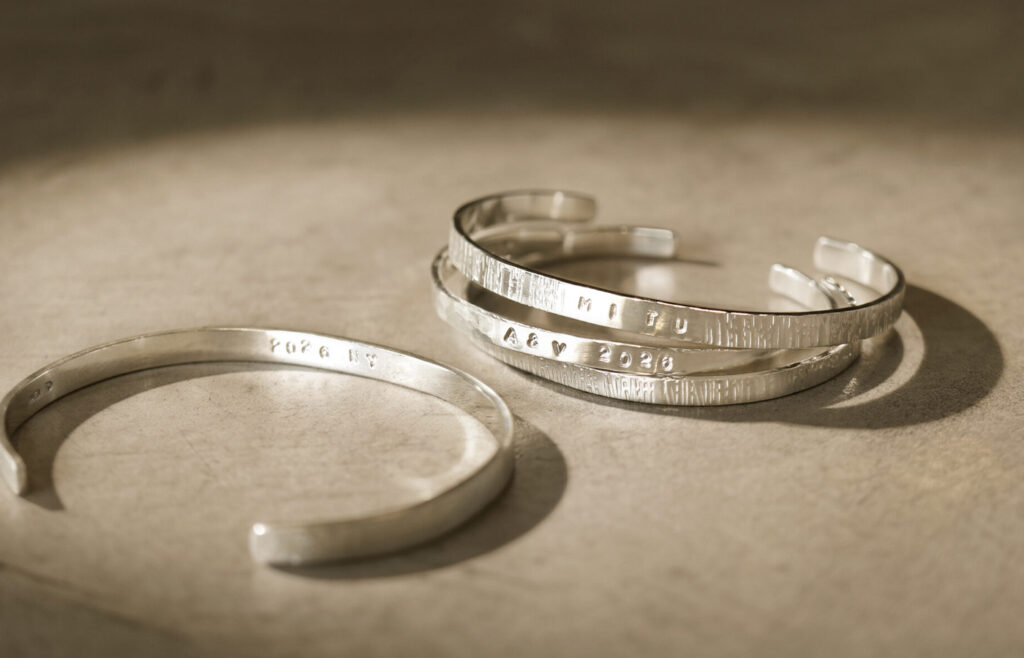 Handmade sterling silver bangles with stamped engravings